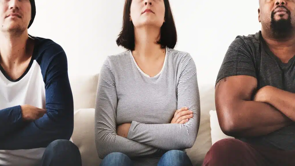 person crossing arms during discussion