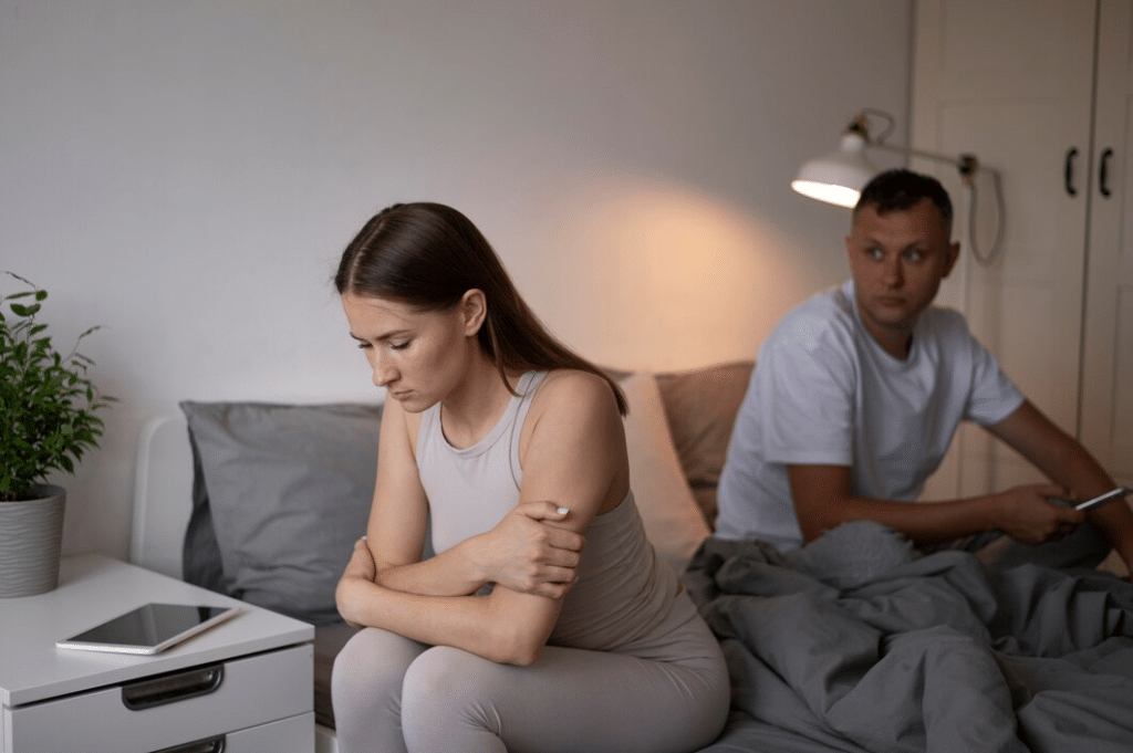 Upset distant couple in bed