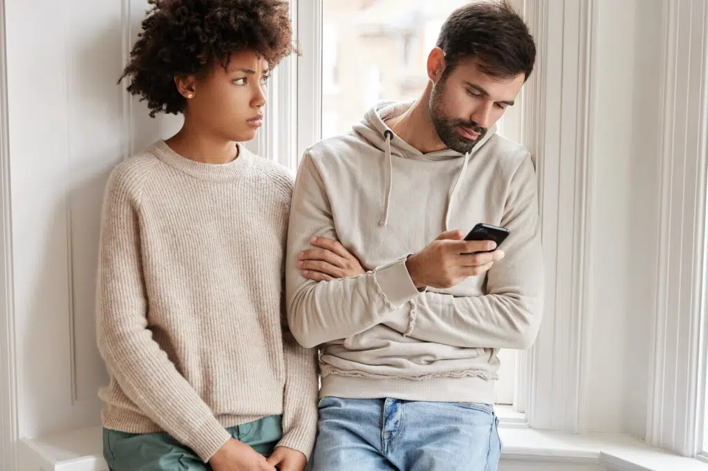 Woman looking worried beside the man