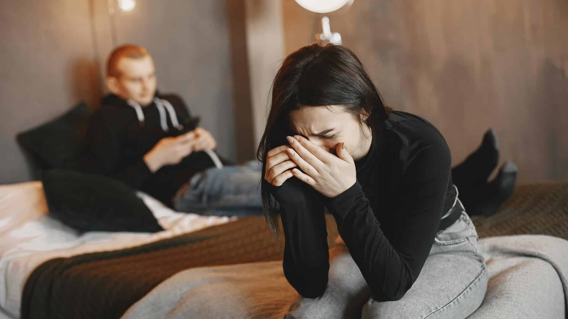 A woman looking upset at her man