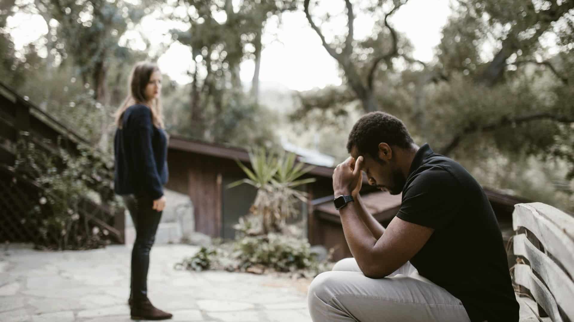 Woman looking at the stressed man
