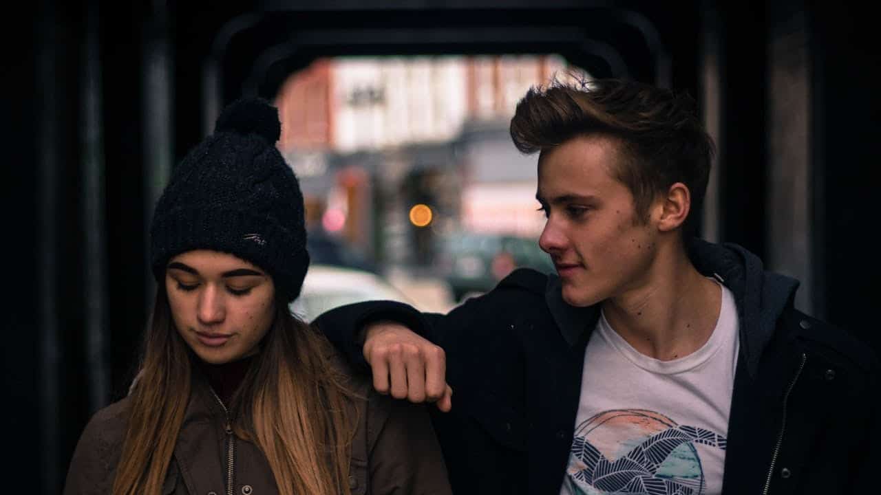 A young couple walking in the city.