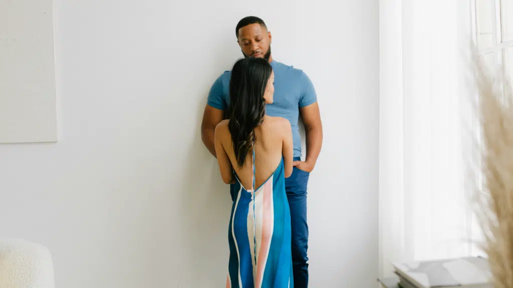 A couple looking sad at home