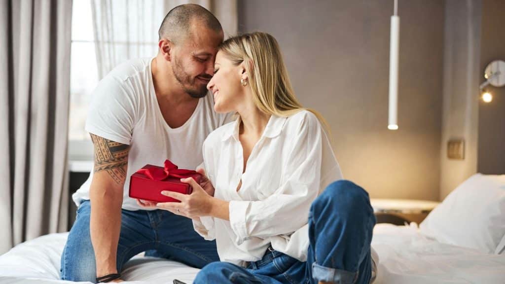 A man giving gift to woman