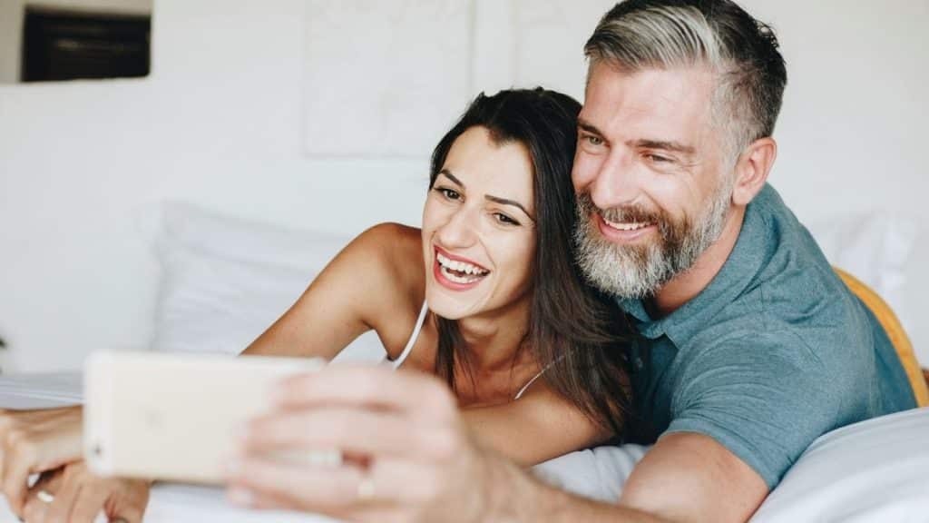 A man and woman taking a picture