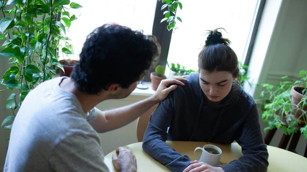 A man listening to woman