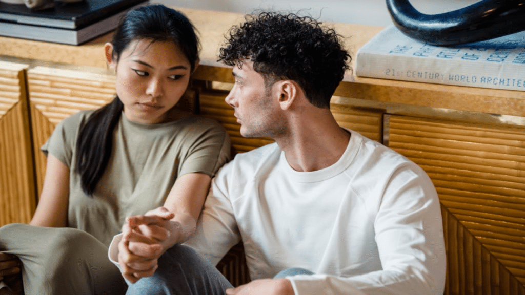 A couple talking on the floor
