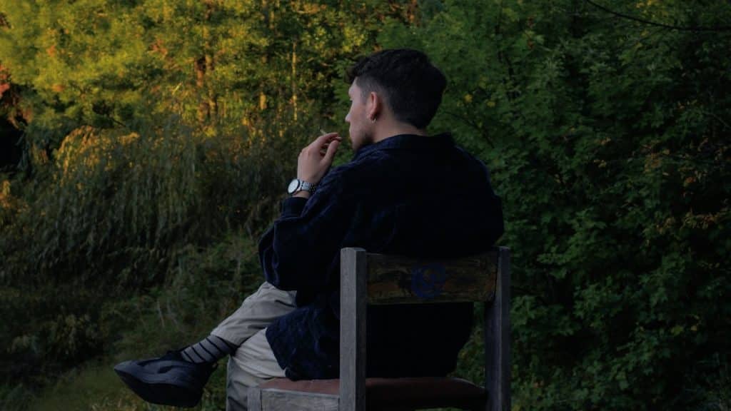 person sitting quietly in thought
