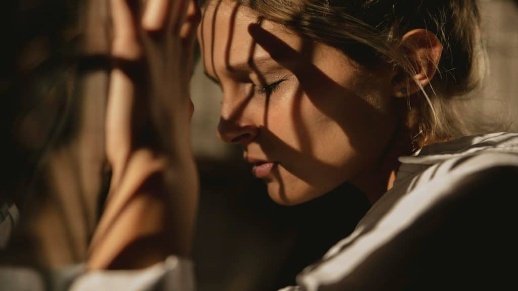 person reflecting emotionally