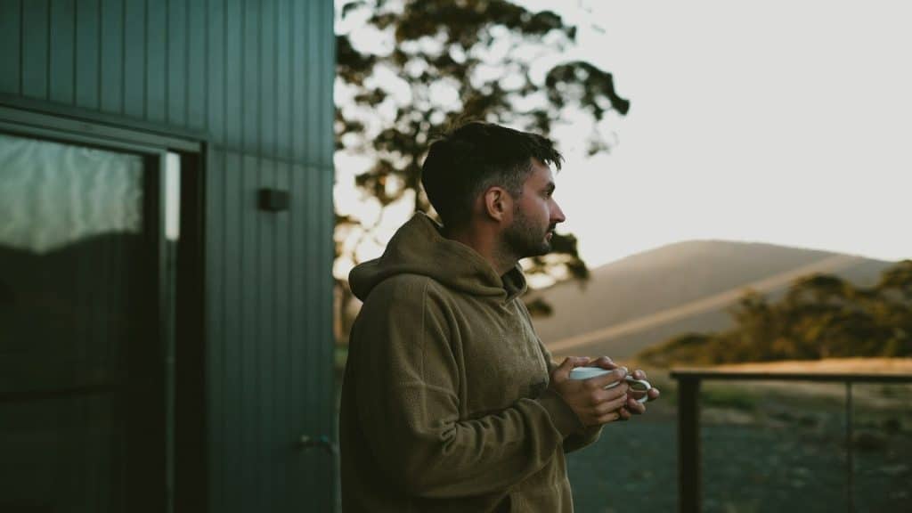 man sitting thoughtfully, reflecting on a relationship
