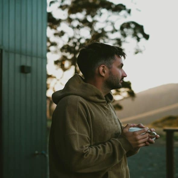 man sitting thoughtfully, reflecting on a relationship