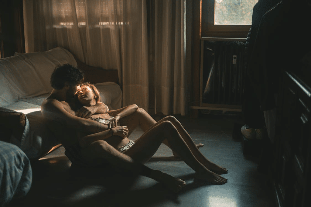A couple cuddling at home together