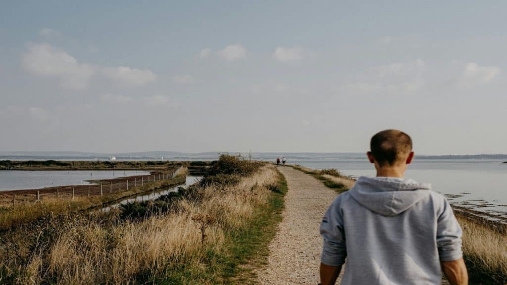 man imagining a different path