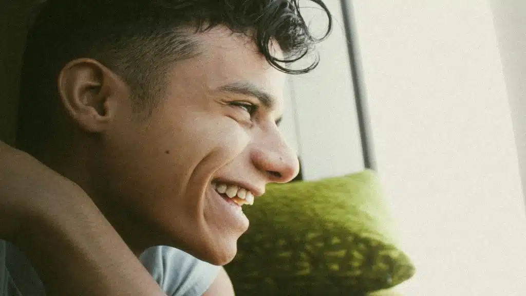 man smiling at a memory