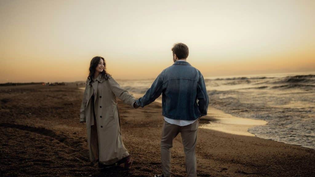 A man and woman holding hands 