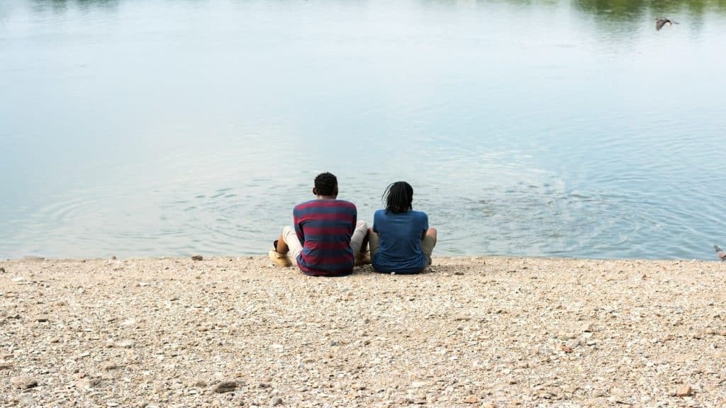 couple sitting apart, reflecting quietly
