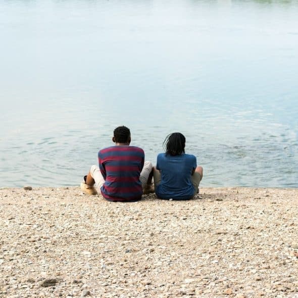 couple sitting apart, reflecting quietly