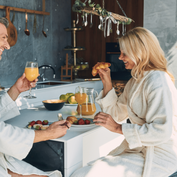 A mature couple enjoying breakfast together