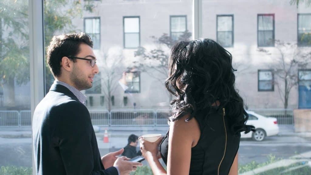 A man and woman talking 