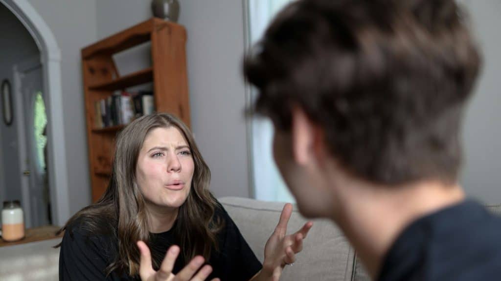 A woman talking to a man