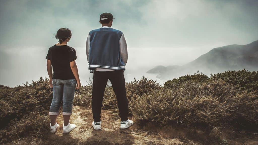 couple standing with slight distance