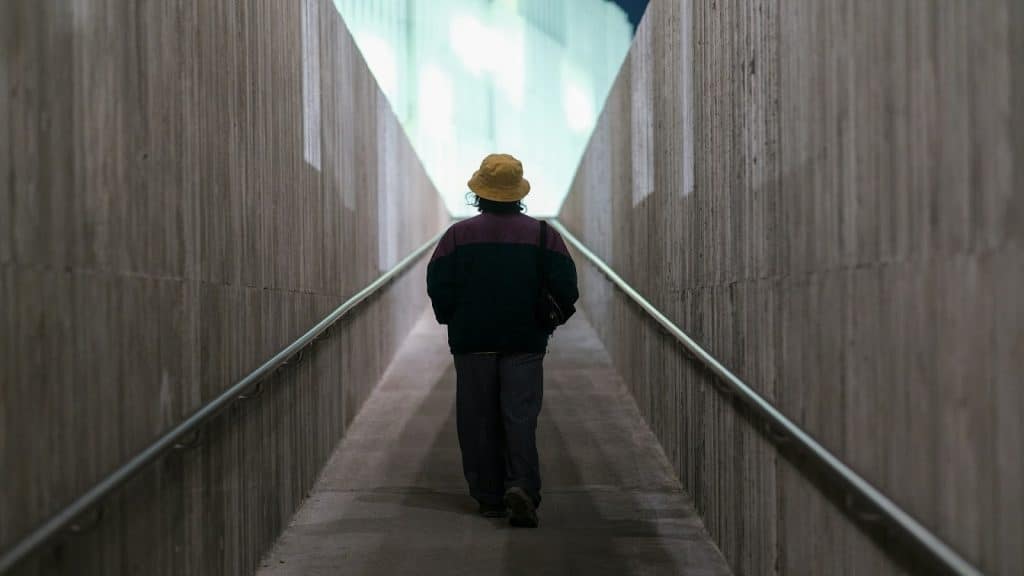 person walking forward alone