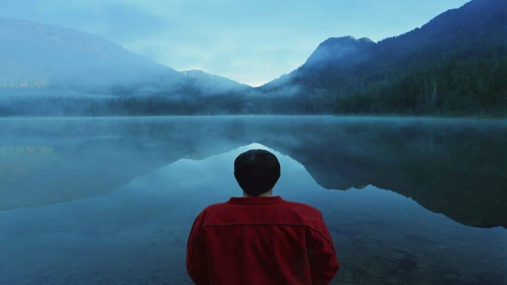 person reflecting quietly alone