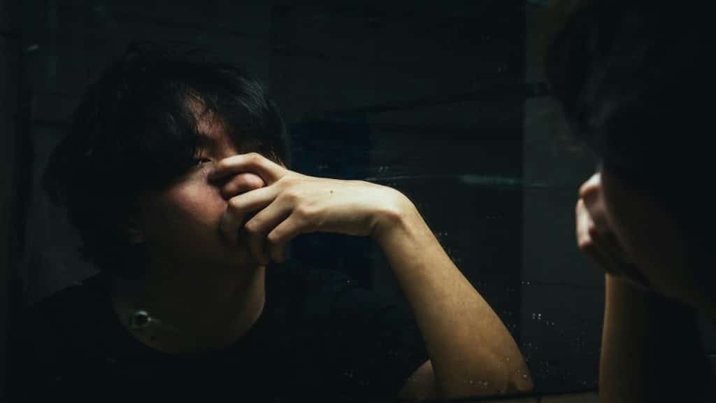 person reflecting emotionally