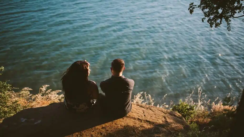 couple sitting with slight emotional distance