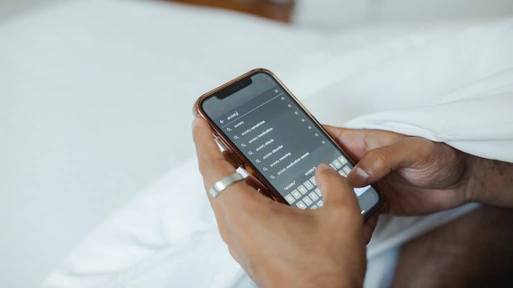 person scrolling through relationship content on a phone