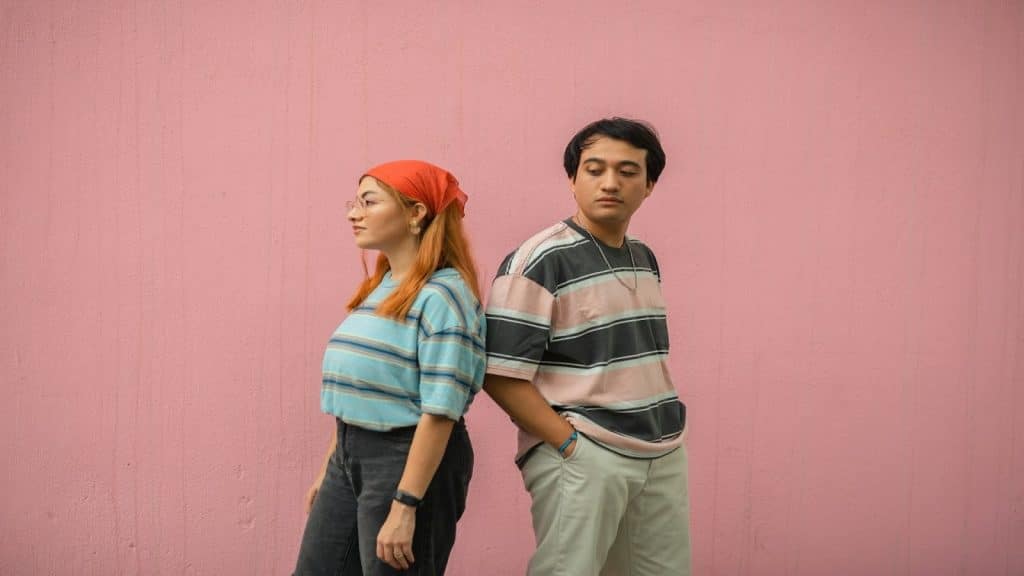 couple standing apart thoughtfully