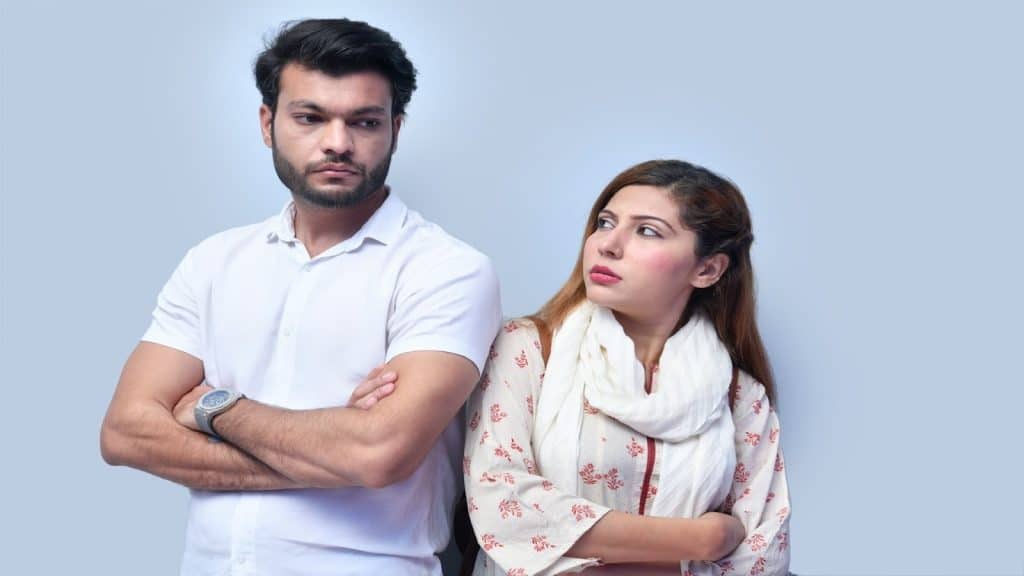 partner looking uncertain while man stays neutral