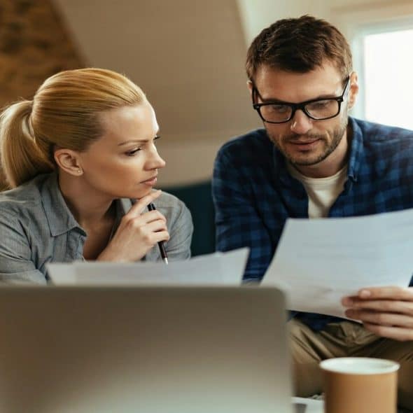 A couple looking at their bills