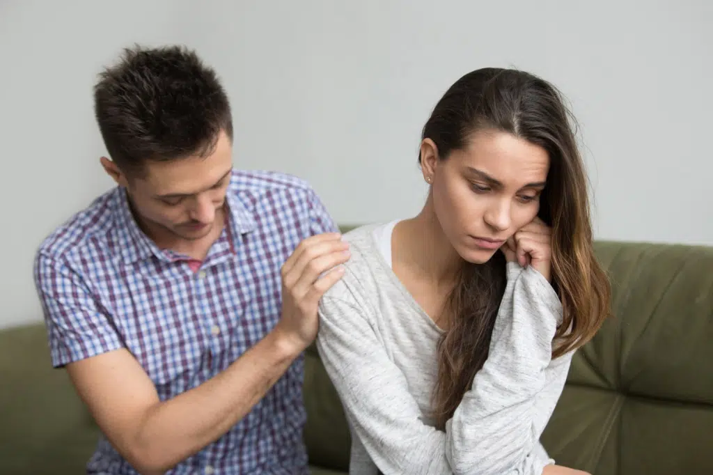 A man asking a woman  what happened 