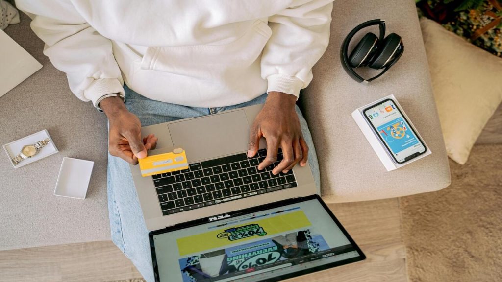 A person using credit card to shop online