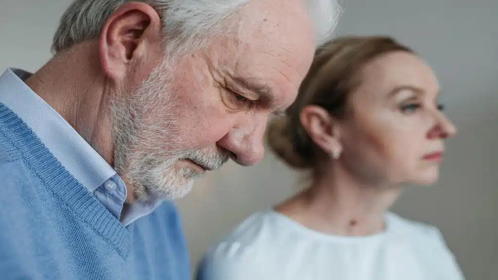A couple looking upset at home