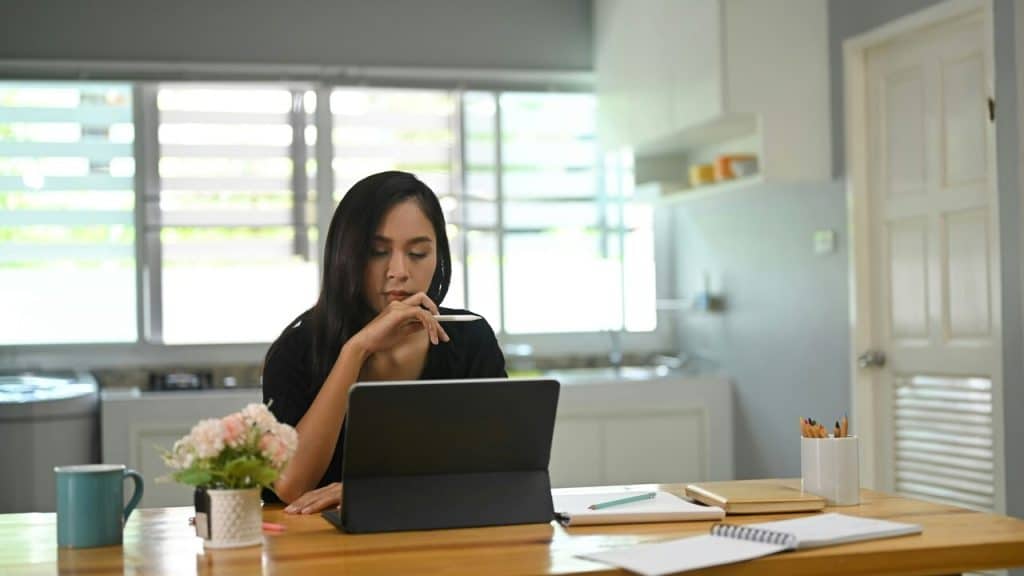 A woman busy working at home