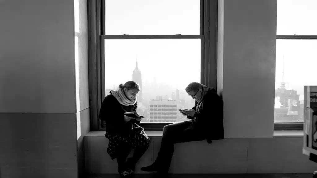 A couple using their phones and not talking