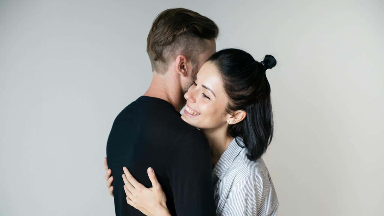 A couple hugging each other.