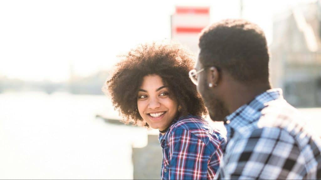 Woman smiling to a man