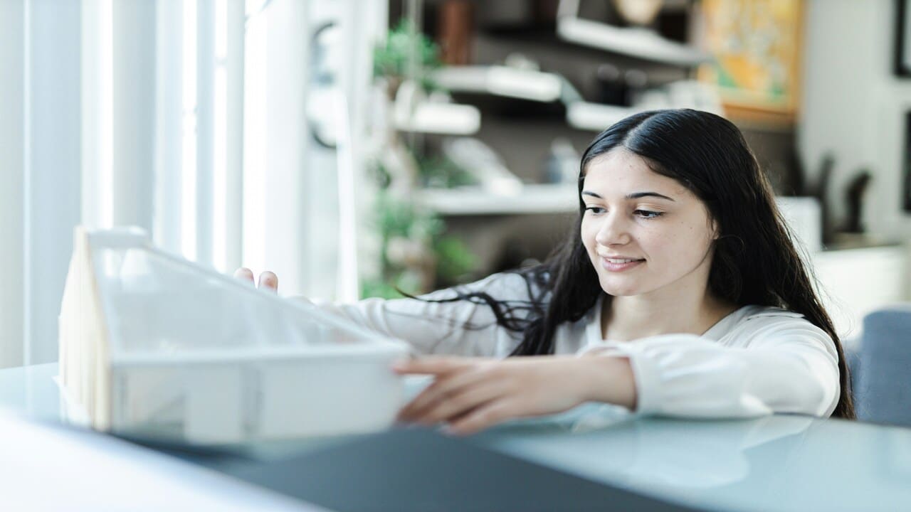 A woman smiling while working