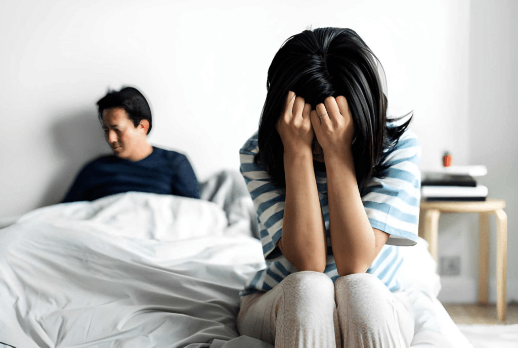 Couple in bed having an argument