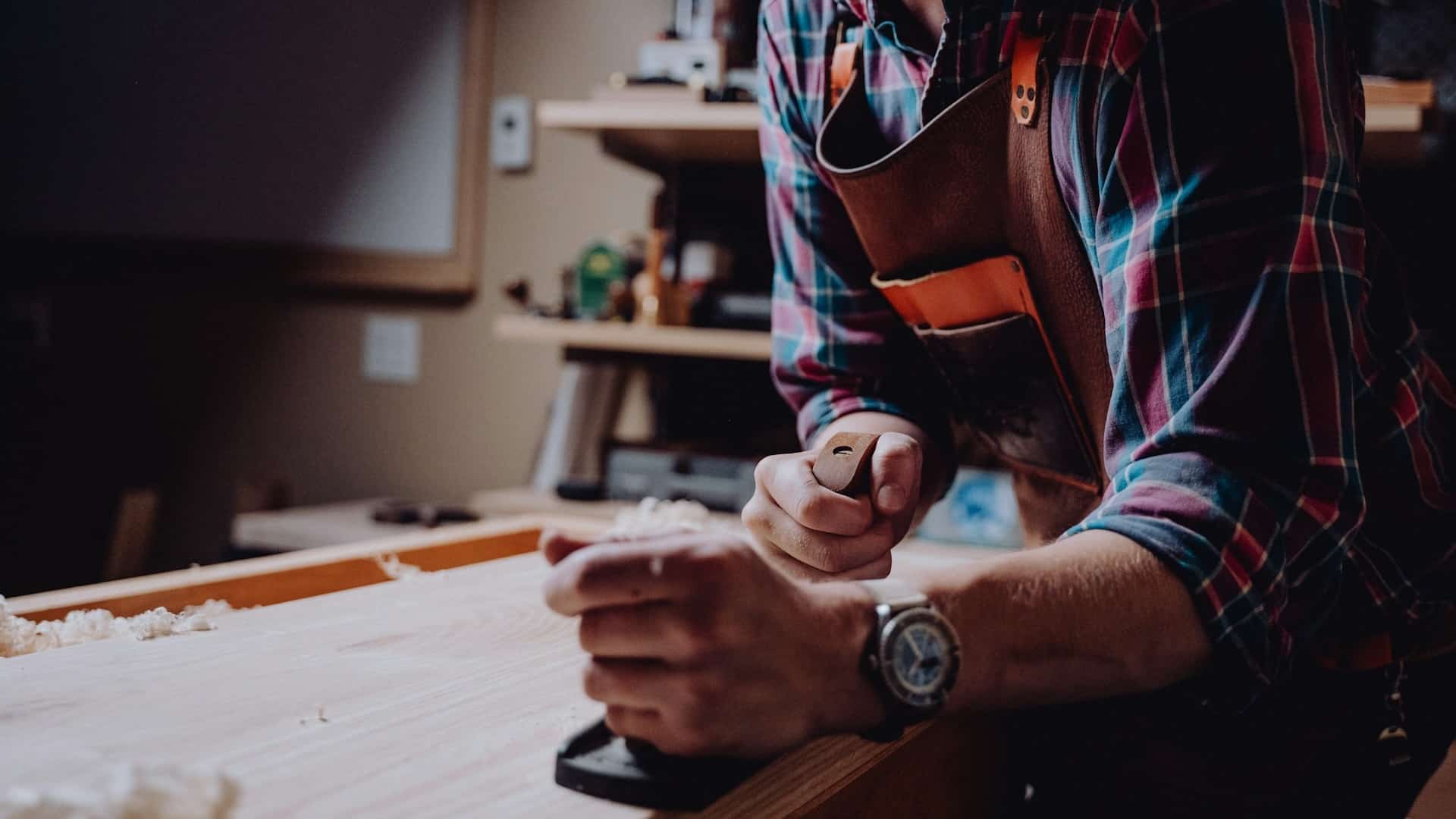 A man working on a piece of wood.
