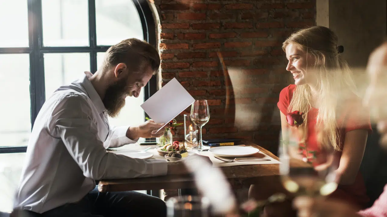A couple looking at a menu