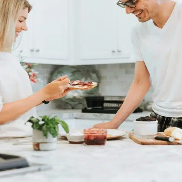 A woman making her husband a toast