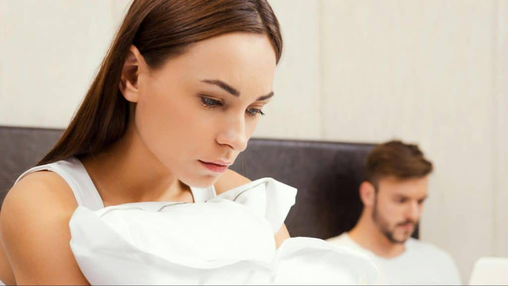 Woman thinking beside a busy man