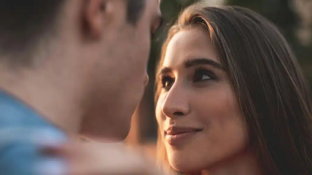 A young man and a woman looking at each other with love.
