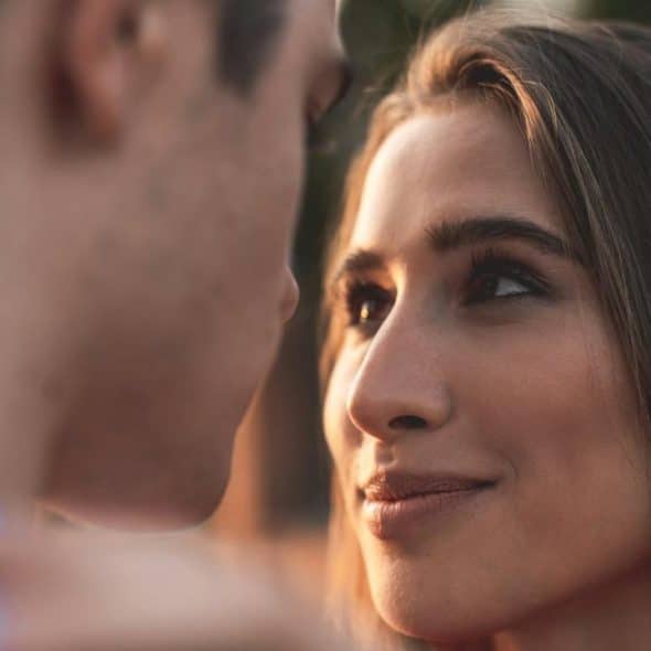 A young man and a woman looking at each other with love.