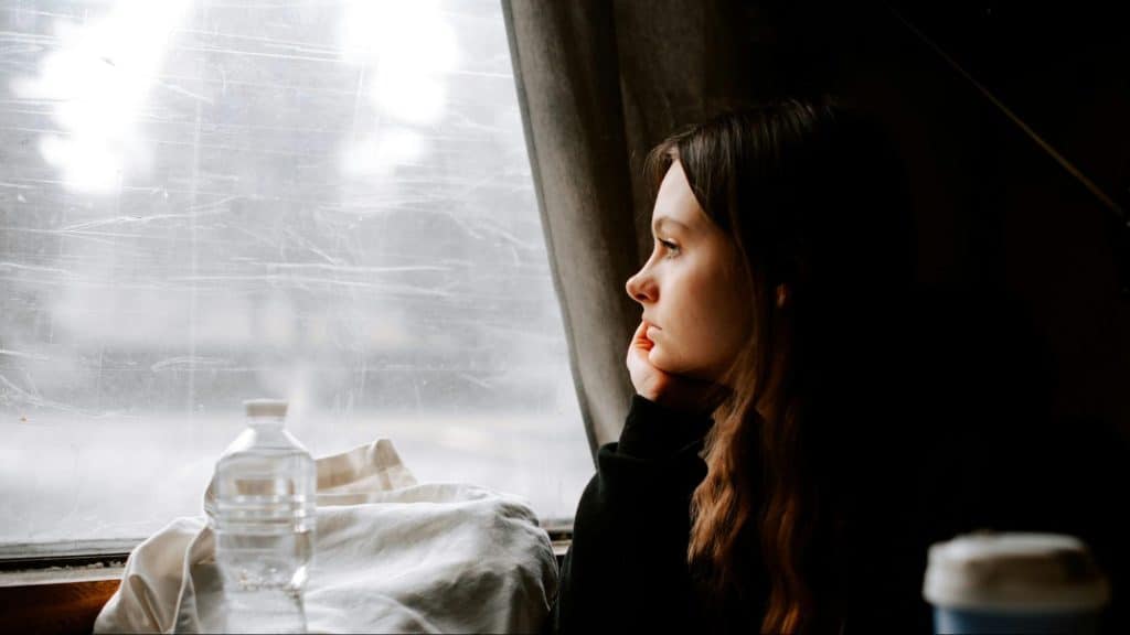 Woman looking at the window