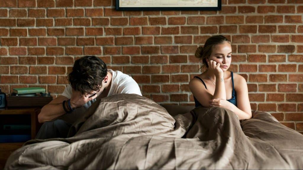 A man and woman ignoring each other